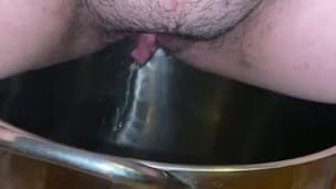 Sexy milf pisses in pot